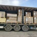 Crated machinery on a curtainsider